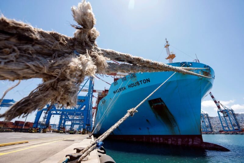 Maersk ship docked with mooring lines