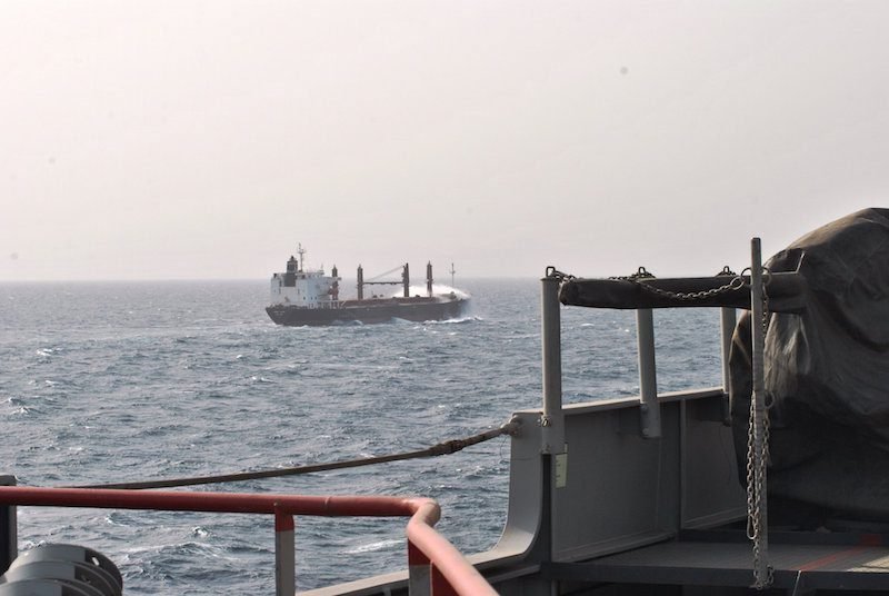 FILE PHOTO: An EUNAVFOR warship escorts a merchant vessel in the Gulf of Aden. Photo: EUNAVFOR