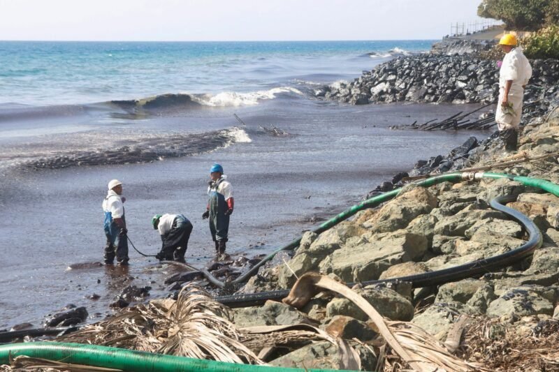 Workers of Oil Mop Environmental Services (OMES) suction oil from a spill at Magdalena Grand Resort, in Tobago Island, Trinidad and Tobago, February 16, 2024. REUTERS/Clement George Williams