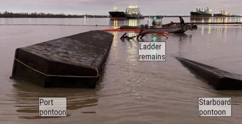 The overturned hull of the WB Wood with its port pontoon on the left and the starboard pontoon on the right the morning after the capsizing. U.S. Coast Guard Photo