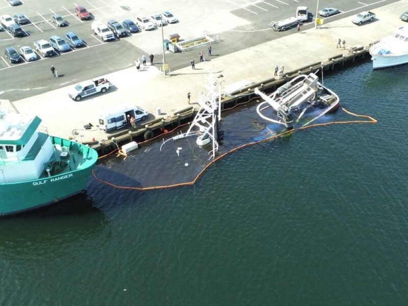 The U.S. Coast Guard, Washington Department of Ecology and other agencies respond to the vessel North American after it sank at a pier in Seattle May 14, 2024. U.S. Coast Guard Photo