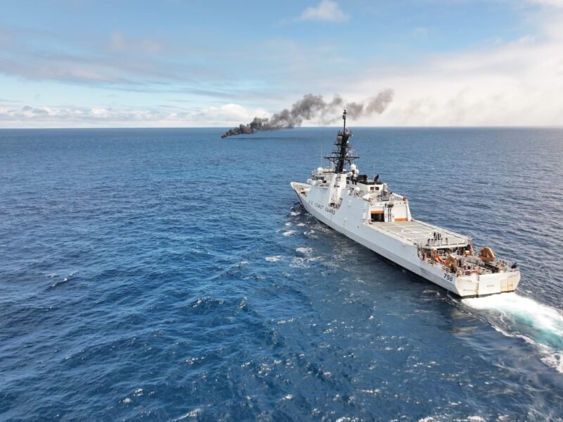 The crew of USCGC Stone (WMSL 758) keeps watch over a burning vessel that was interdicted in the Eastern Pacific Ocean