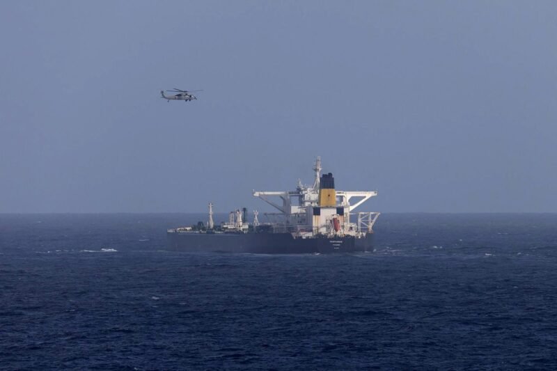 A U.S. military helicopter flies over the Panama-flagged Centuries, which was intercepted by the U.S. Coast Guard, days after U.S. President Donald Trump announced a "blockade" of all sanctioned oil tankers