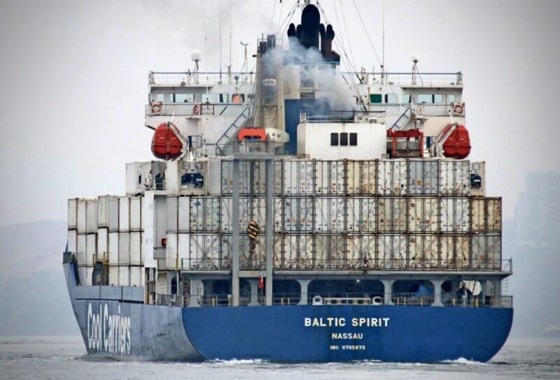 Stern view of the con-ro vessel BALTIC SPIRIT underway, with containers stacked on deck.