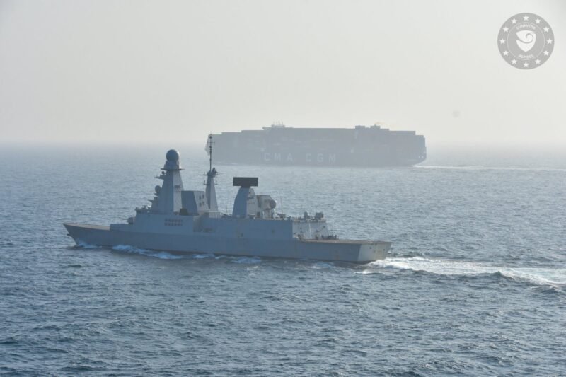 EUNAVFOR warship escorts a containership in the Red Sea as part of the EU's Operation ASPIDES