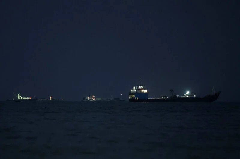 Vessels in the Strait of Hormuz are visible near the beach of Bandar Abbas