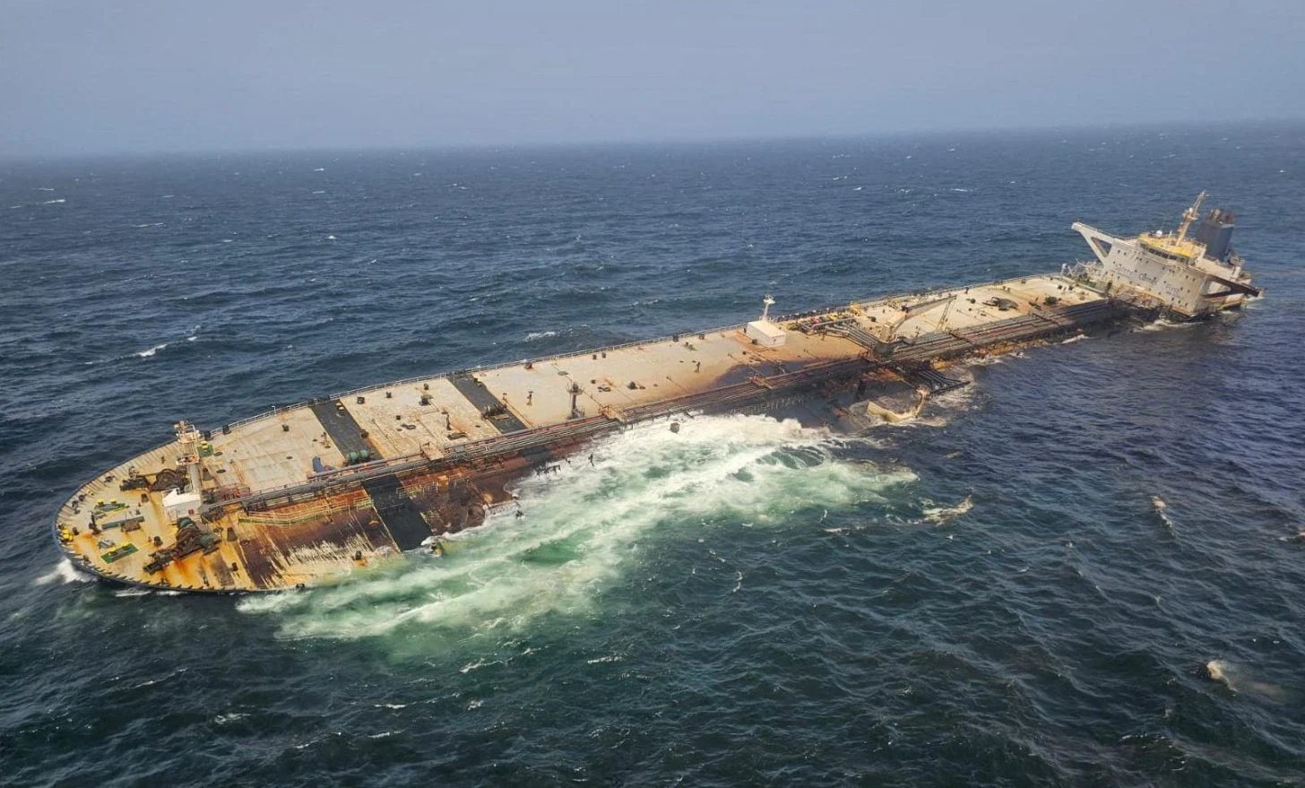The damaged and half sunk oil tanker Caroline Bezengi, at sea off the coast of Oman
